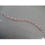 18ct White gold pink sapphire and diamond cluster line bracelet