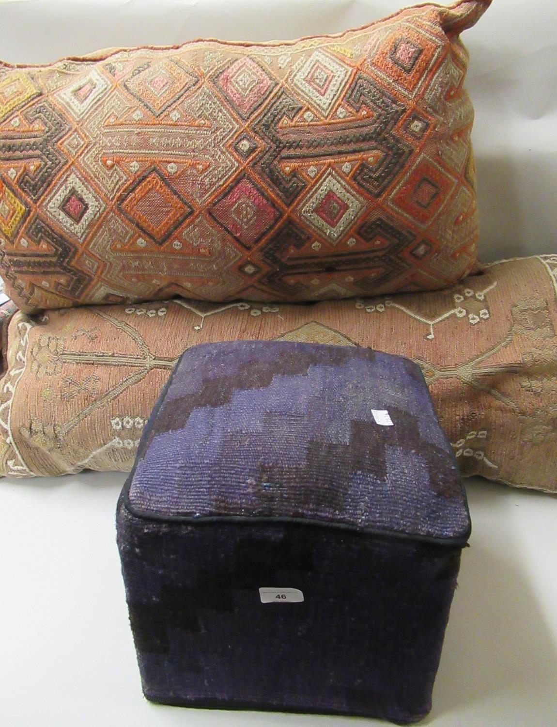 Two large Kelim covered cushions and a small Kelim covered stool