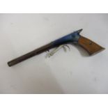 Good quality miniature novelty pistol with wooden stock, 5.25ins long We believe it to be a