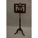Reproduction mahogany duet music stand in Victorian style, the adjustable lyre shaped top above a