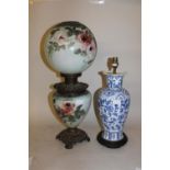 Gilt metal mounted opaque glass oil lamp decorated with roses, together with a modern Chinese blue