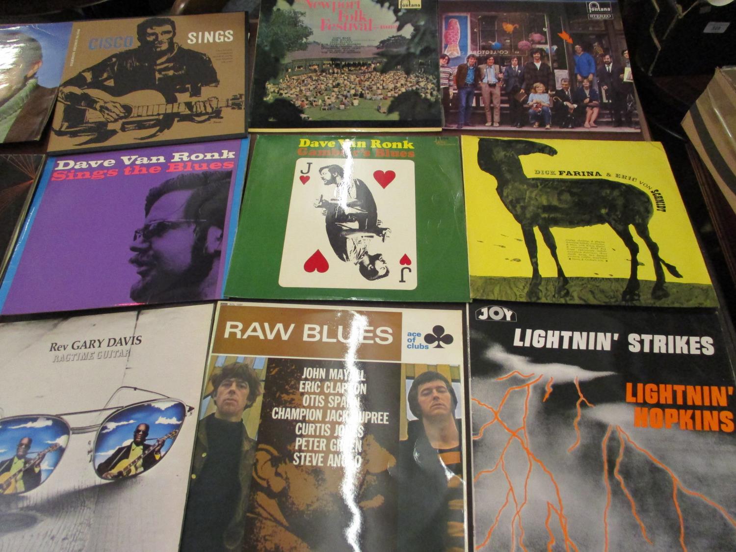 Collection of vinyl long playing records including Eric Clapton, Joan Baez and Tom Paxton