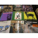 Collection of vinyl long playing records including Eric Clapton, Joan Baez and Tom Paxton