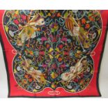 Gucci, red and black silk scarf with floral and musical design, 34ins x 34ins Biro pen mark about an