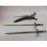 Two Indian bayonets, a kukri and a Malaysian kris