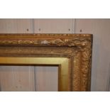 Large rectangular gilt composition picture frame, 36.5ins x 24.25ins rebate, together with five