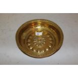 Small antique brass alms dish with punched and embossed decoration, 9.5ins diameter