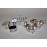 Silver six division toast rack, two silver sauce boats (at fault) and two silver condiments, 16ozs