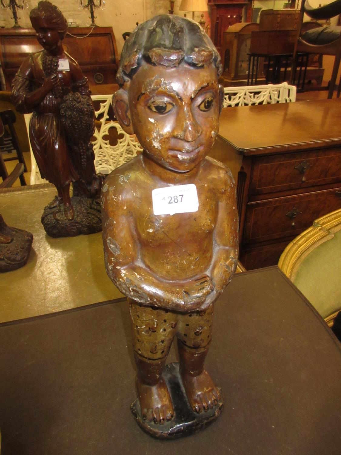 Antique Eastern carved and painted wooden figure of a boy, 18ins high
