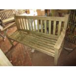 Wooden slatted garden bench and a similar smaller bench