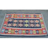 Small Kelim rug with blue ground, geometric design centre panel and rose ground border, 5ft x 3ft