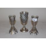 Pair of sterling silver candlesticks of castellated and pierced design, 5.5ins high, 10 troy ounces,