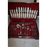 Six place setting canteen of plated cutlery in a walnut and mahogany case