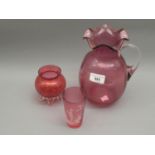 Cranberry glass baluster form vase, similar smaller vase and a Mary Gregory type beaker