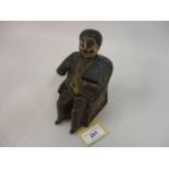 19th Century painted cast iron ' Tammany ' money bank in the form of a seated gentleman wearing a