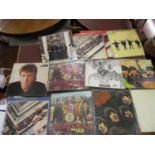 Collection of Beatles albums, ' Help ', ' Revolver ', two copies of ' Sergeant Pepper ', ' Beatles
