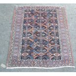 Small Kurdish mat with a repeating serrated leaf centre panel with dark ground and triple border,