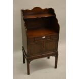 Edwardian mahogany night stand in Georgian style with a shelf back above drawer and two panel doors,