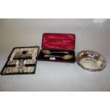 Two George III silver berry spoons in fitted case together with a circular plated bowl, cased set of