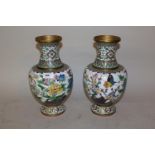 Pair of 20th Century cloisonne vases with bird and floral designs on a white ground, 12ins high (one