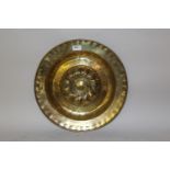 16th / 17th Century brass alms dish with impressed marks to the outer edging and a raised centre