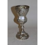 Floral embossed white metal chalice, 9.5ins high, 10 troy ounces there are two touch marks - see