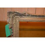 Swept gilt picture frame, 43.75ins x 27.75ins rebate together with four other various frames 26.5ins