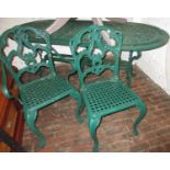 Green painted cast alloy garden table together with a set of four (three plus one) matching chairs