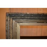 Large 19th Century rectangular gilt composition frame, 50ins x 40ins rebate (at fault), together