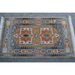 Small machine woven Persian design rug with twin medallion design, 3ft 8ins x 2ft 4ins