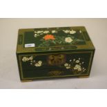 Reproduction green lacquer jewellery box, the hinged lid enclosing a fitted interior above a