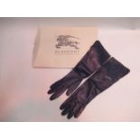 Pair of Burberry ladies black leather long gloves, with original tag and box