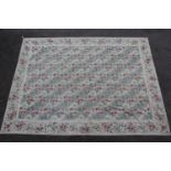 Indian Numdah carpet worked with an all-over stylised floral design, 103in x 139in