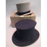 Lock and Co. grey top hat, together with a Dunn and Co. black folding opera top hat