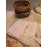 Small quantity of miscellaneous lace and other table linen, together with six various small wicker