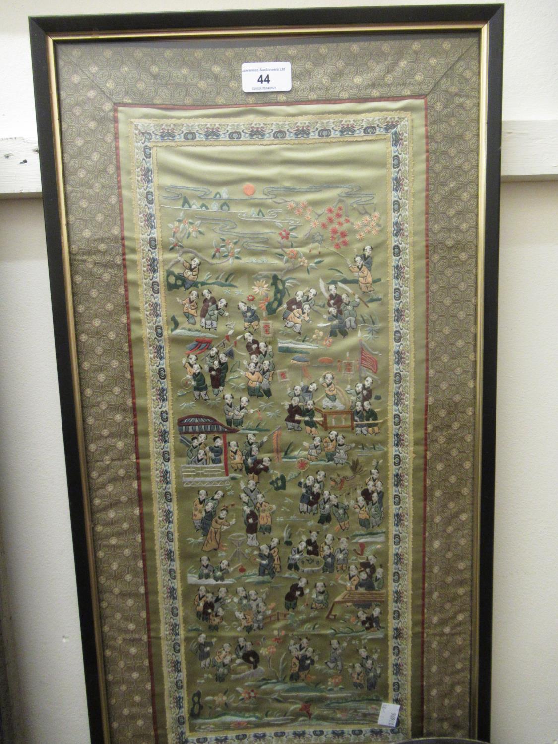 Chinese silk embroidered sleeve panel depicting figures in a landscape, 25.5ins x 12.5ins, framed
