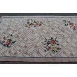 Chinese rug with a lattice and floral design on beige ground, 93ins x 59ins approximately