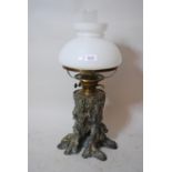 Unusual cast bronze oil lamp in the form of a tree stump