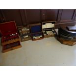 Four cased sets of silver plated cutlery and a quantity of empty canteen wooden boxes etc.