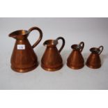 Graduated set of four antique copper measures