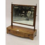 George III mahogany and line inlaid rectangular swing frame toilet mirror with a three drawer bow