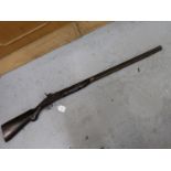 Antique flintlock rifle (converted to percussion cap) having ramrod, brass mounts and mahogany
