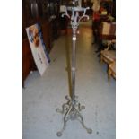 Early 20th Century brass oil lamp standard, the reeded column above a scroll design quadruped base