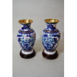 Pair of modern blue and white cloisonne baluster form vases decorated with flowers and birds, on