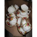 Royal Albert Country Rose tea cups and saucers, side plates and cream jug, nineteen pieces in total