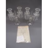 Pair of Baccarat glass twin light candelabra with prismatic glass drops, 12.75ins high