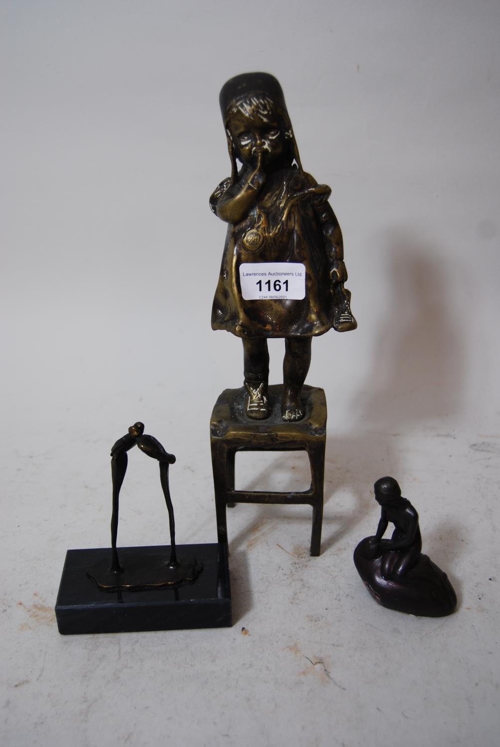 Bronze figure of a young girl standing on a stool, 11.5ins high, together with a small