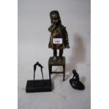 Bronze figure of a young girl standing on a stool, 11.5ins high, together with a small