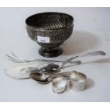 Birmingham silver embossed pedestal bowl with wrythen decoration, two silver napkin rings,