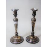 Pair of 19th Century silver plated candlesticks on circular plinth bases, 12.5ins tall